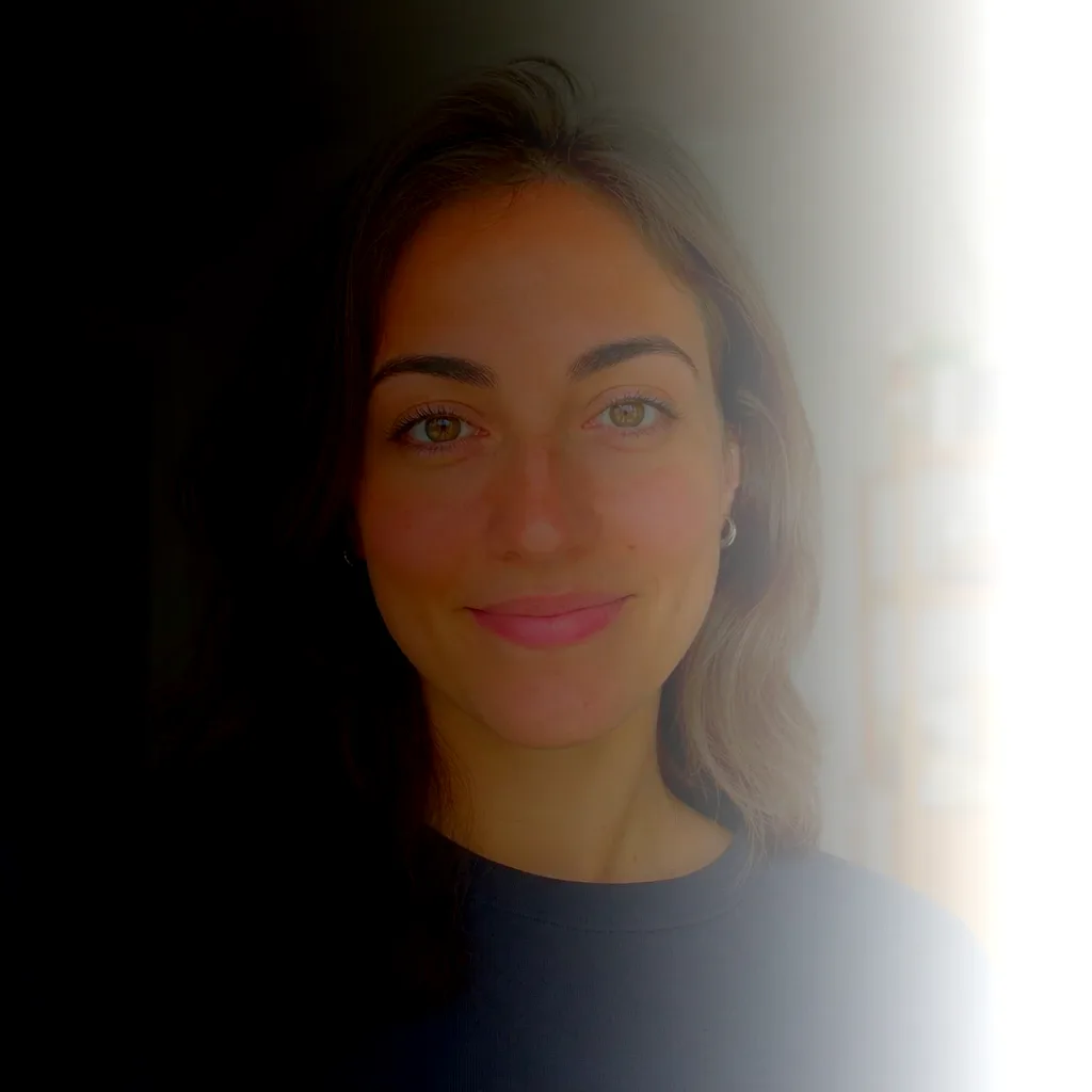 Backlit photo of a person against a bright window, face in shadow